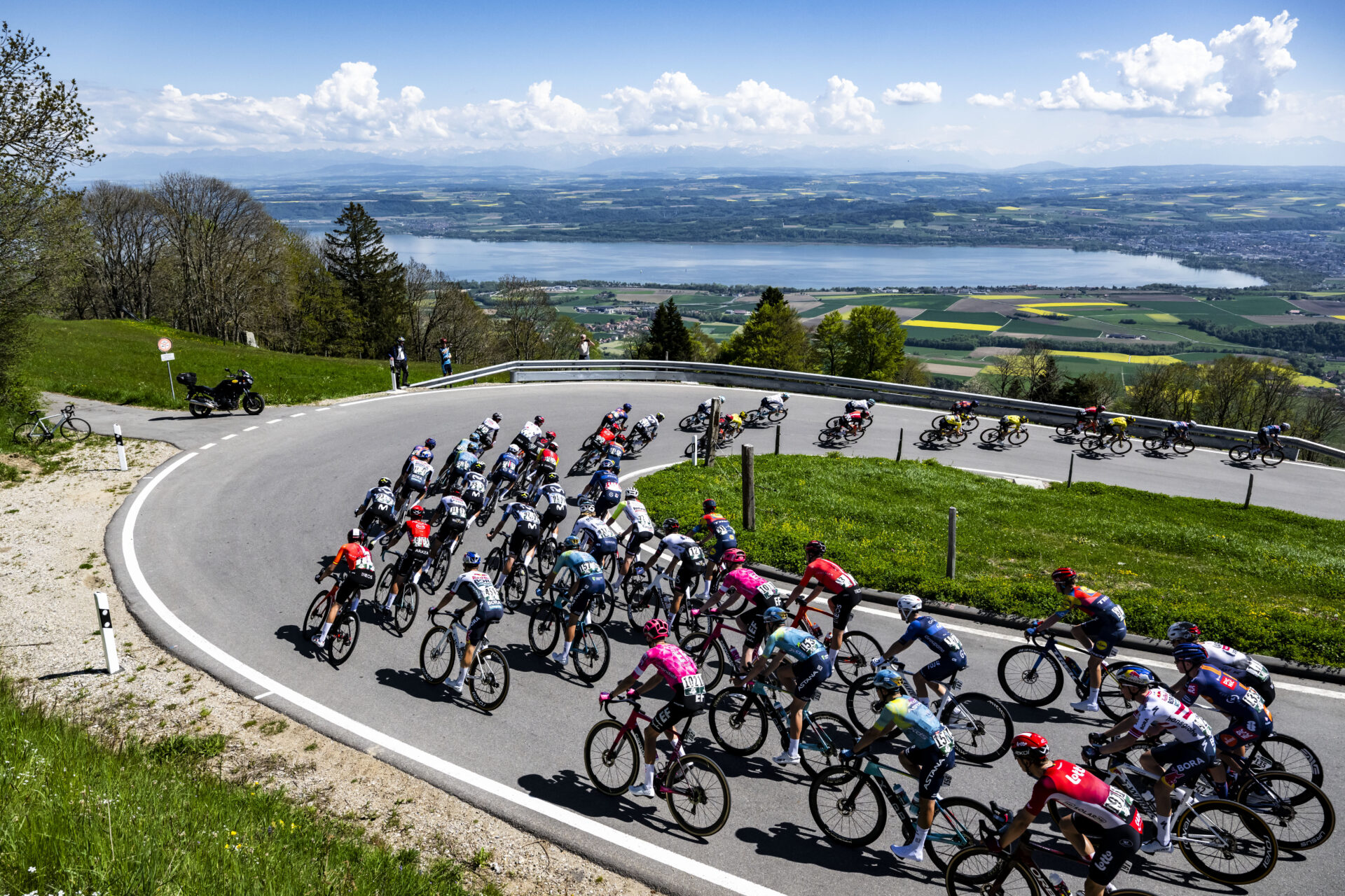The Pack in action during the second stage, a 157 km race between La Grande Beroche and La Grande Beroche at the 78th Tour de Romandie UCI World Tour Cycling race, in Mauborget, Switzerland, Thursday, May 1, 2025. (KEYSTONE/Jean-Christophe Bott)