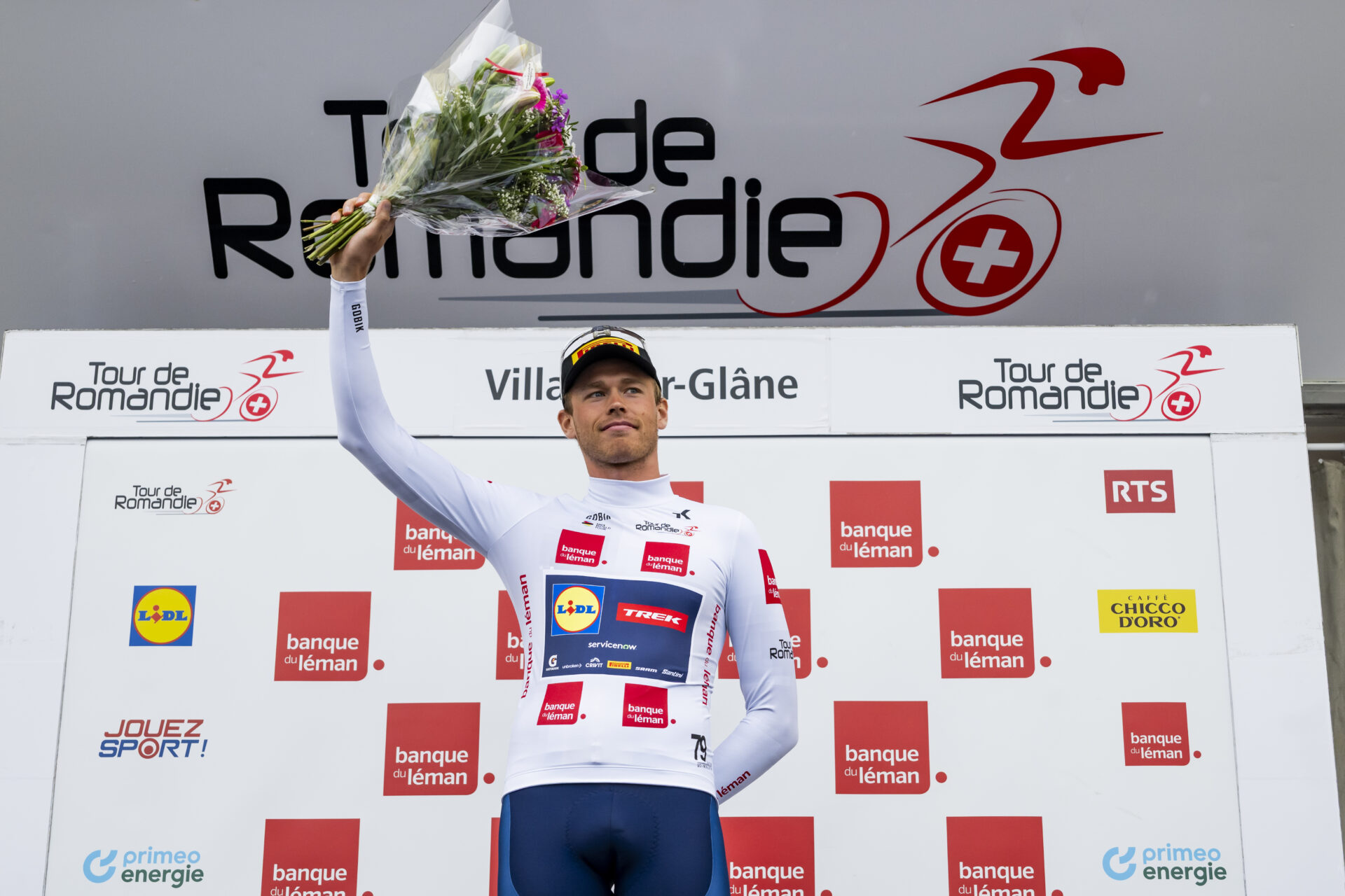 Jakob Soderqvist from Sweden of team Lidl-Trek celebrates on the podium during the prologue, a 3,2 km race against the clock at the 79th Tour de Romandie UCI World Tour Cycling race, in Villars-sur-Glane, Switzerland, Tuesday, April 28, 2026. (KEYSTONE/Jean-Christophe Bott)