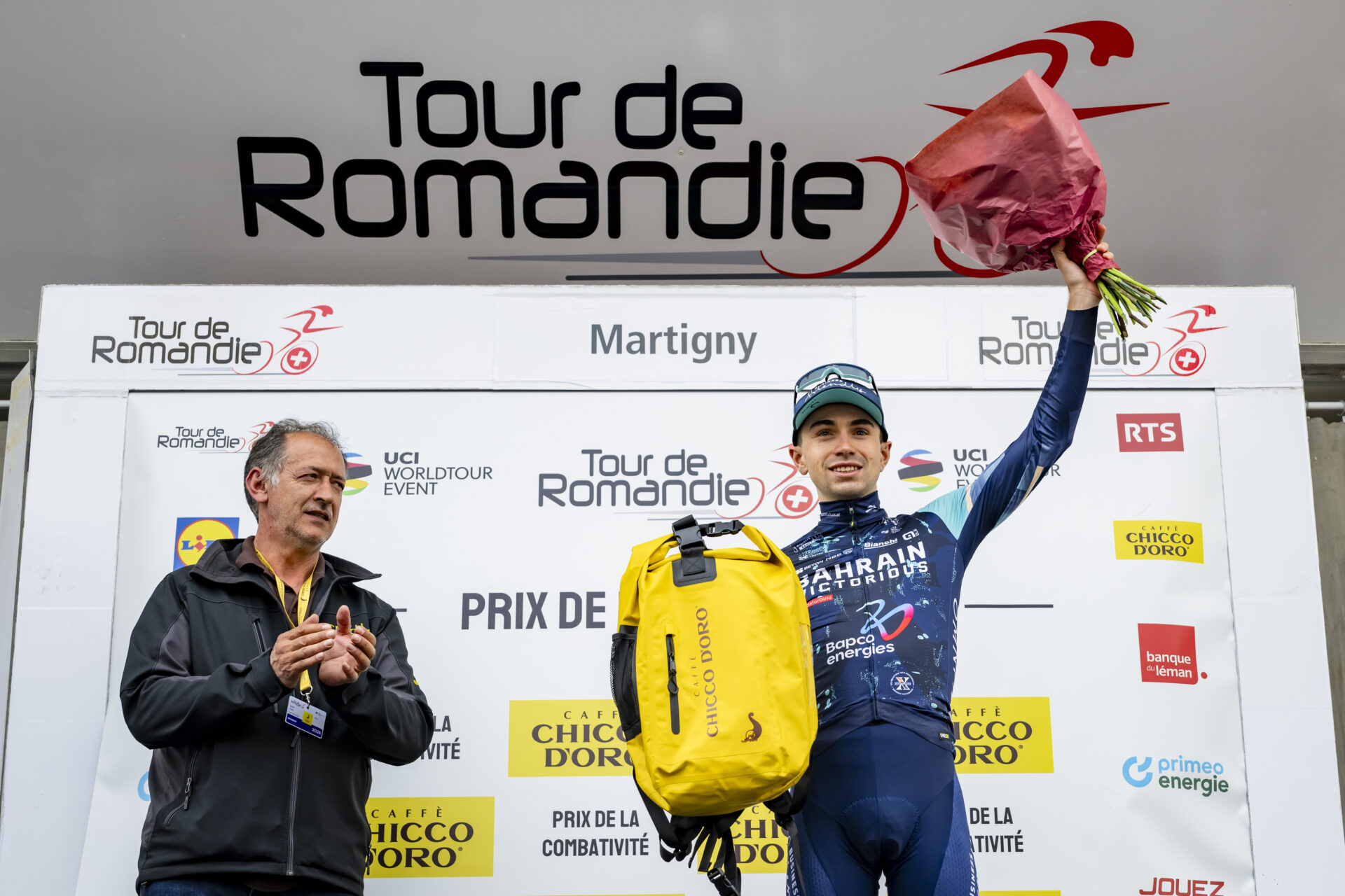 Lenny Martinez from France of team Bahrain Victorious celebrates on the podium during the first stage, a 170,6 km race around Martigny at the 79th Tour de Romandie UCI World Tour Cycling race, in Martigny, Switzerland, Wednesday, April 29, 2026. (KEYSTONE/Jean-Christophe Bott)