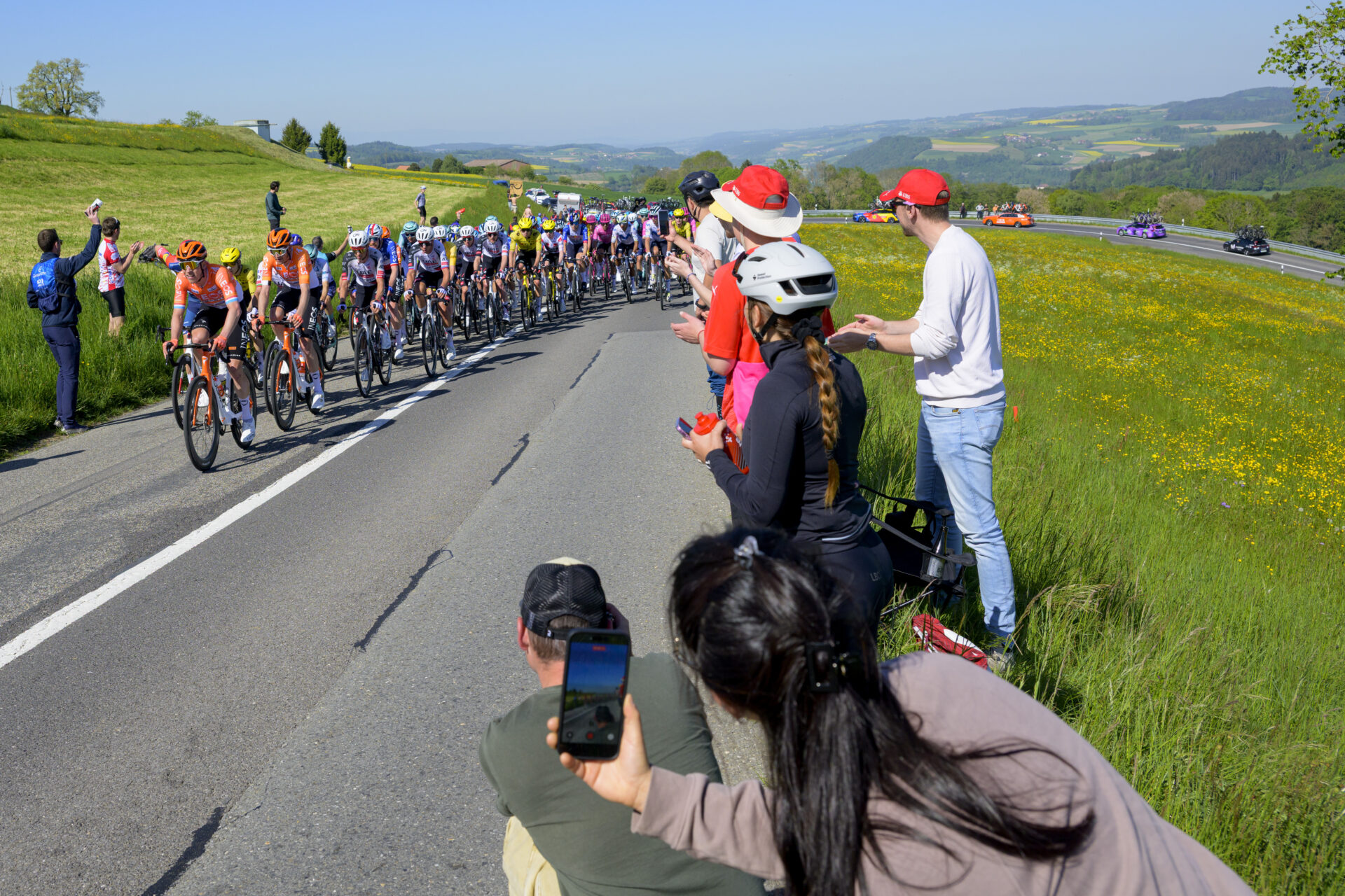 The pack of riders in action during the second stage, a 173,1 km race between Rue and Vucherens at the 79th Tour de Romandie UCI World Tour Cycling race, in Corcelles-le-Jorat, Switzerland, Thursday, April 30, 2026. (KEYSTONE/Jean-Christophe Bott)