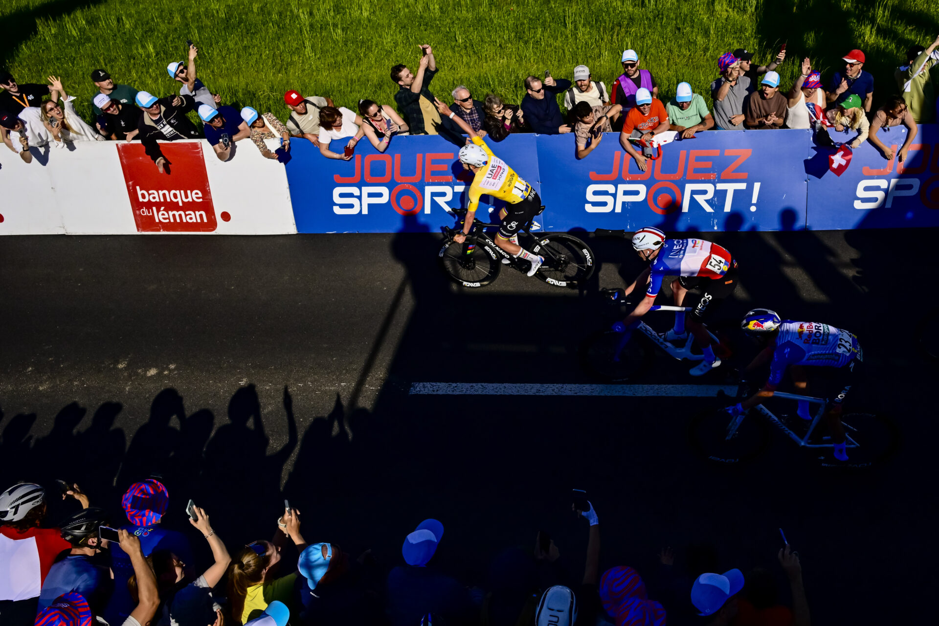 KEYPIX - The winner of thge stage and overall leader Tadej Pogacar from Slovenia of UAE Team Emirates XRG, left, celebrates as he crosses the finish line next to Dorion Godon from France of team INEOS Grenadiers, center, and Finn Fisher-Black from New Zealand of team Red Bull BORA hansgrohe, right, during the second stage, a 173,1 km race between Rue and Vucherens at the 79th Tour de Romandie UCI World Tour Cycling race, in Vucherens, Switzerland, Thursday, April 30, 2026. (KEYSTONE/Jean-Christophe Bott)