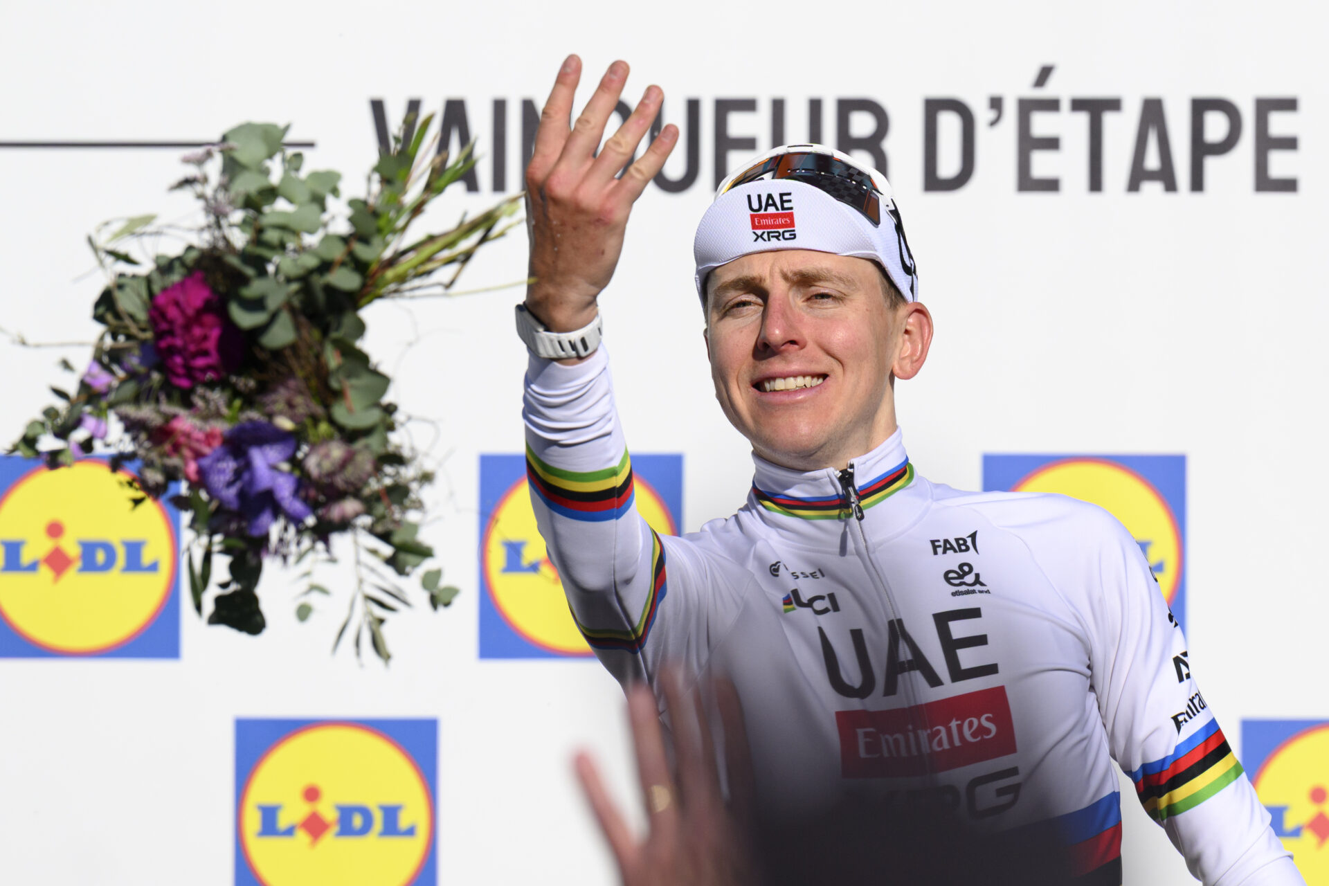 Overall leader Tadej Pogacar from Slovenia of UAE Team Emirates XRG celebrates on the podium after winning the second stage, a 173,1 km race between Rue and Vucherens at the 79th Tour de Romandie UCI World Tour Cycling race, in Vucherens, Switzerland, Thursday, April 30, 2026. (KEYSTONE/Laurent Gillieron)