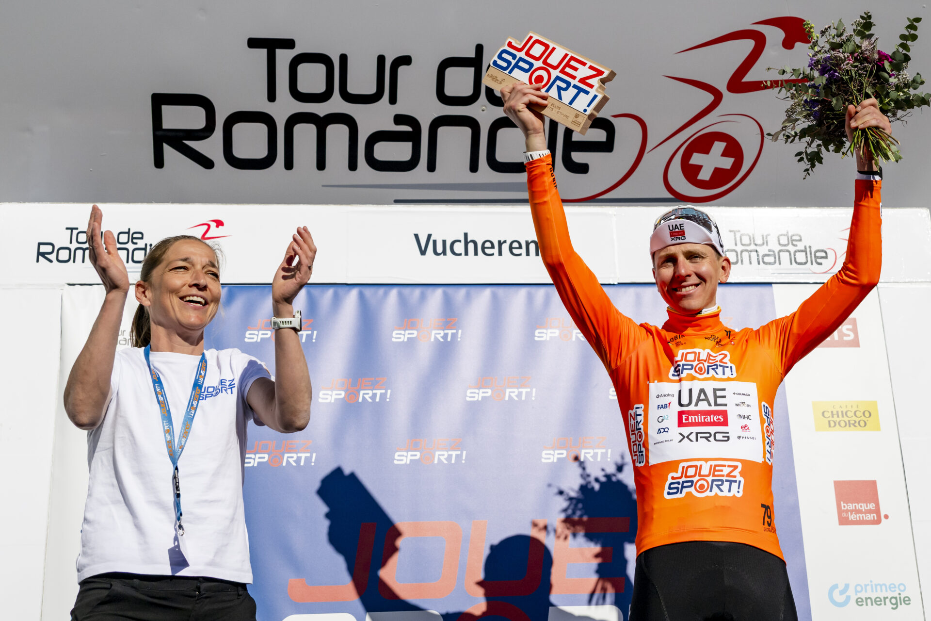 The winner of the stage Tadej Pogacar from Slovenia of UAE Team Emirates XRG celebrates on the podium during the second stage, a 173,1 km race between Rue and Vucherens at the 79th Tour de Romandie UCI World Tour Cycling race, in Vucherens, Switzerland, Thursday, April 30, 2026. (KEYSTONE/Jean-Christophe Bott)