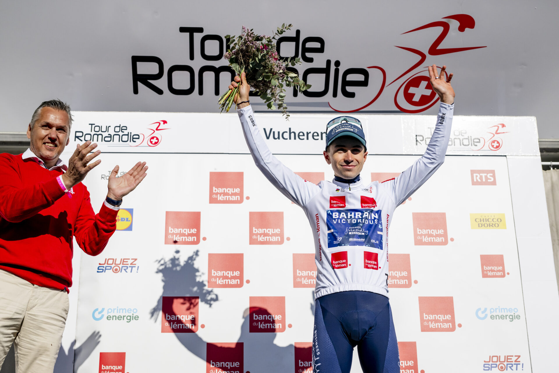 Lenny Martinez from France of team Bahrain Victorious celebrates on the podium during the second stage, a 173,1 km race between Rue and Vucherens at the 79th Tour de Romandie UCI World Tour Cycling race, in Vucherens, Switzerland, Thursday, April 30, 2026. (KEYSTONE/Jean-Christophe Bott)