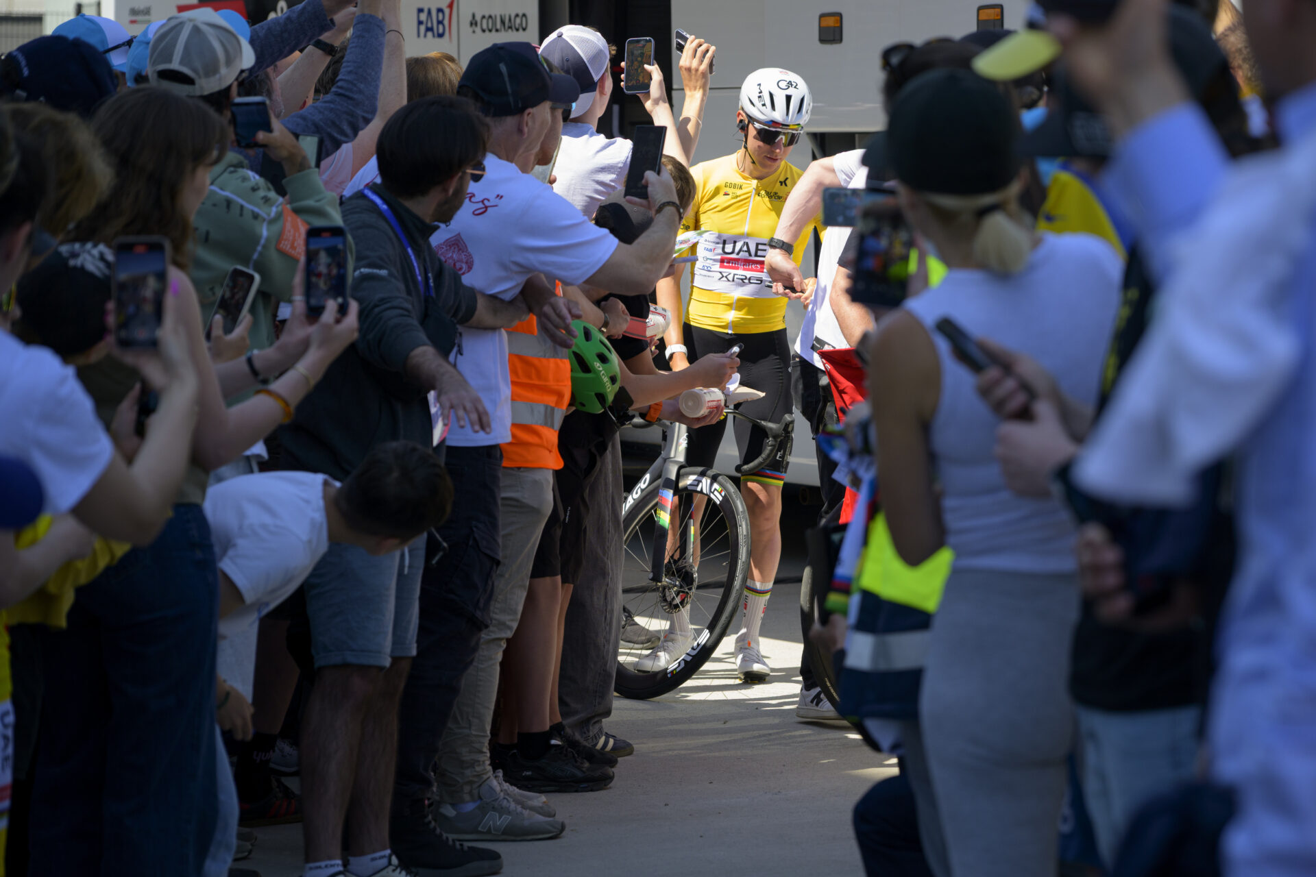 Overall leader Tadej Pogacar from Slovenia of UAE Team Emirates XRG arrives before the start of the third stage, a 176,6 km race around Orbe at the 79th Tour de Romandie UCI World Tour Cycling race, in Orbe, Switzerland, Friday, May 1, 2026. (KEYSTONE/Jean-Christophe Bott)