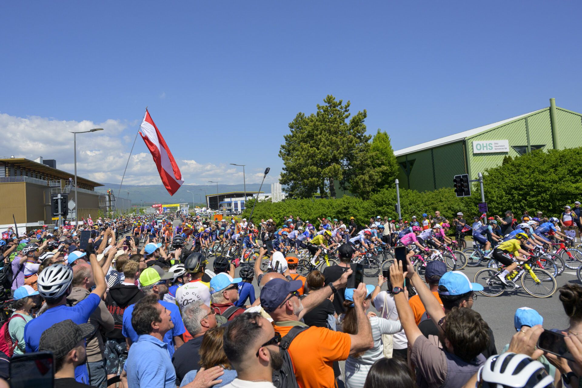 The pack of riders taking the start of the third stage, a 176,6 km race around Orbe at the 79th Tour de Romandie UCI World Tour Cycling race, in Orbe, Switzerland, Friday, May 1, 2026. (KEYSTONE/Jean-Christophe Bott)