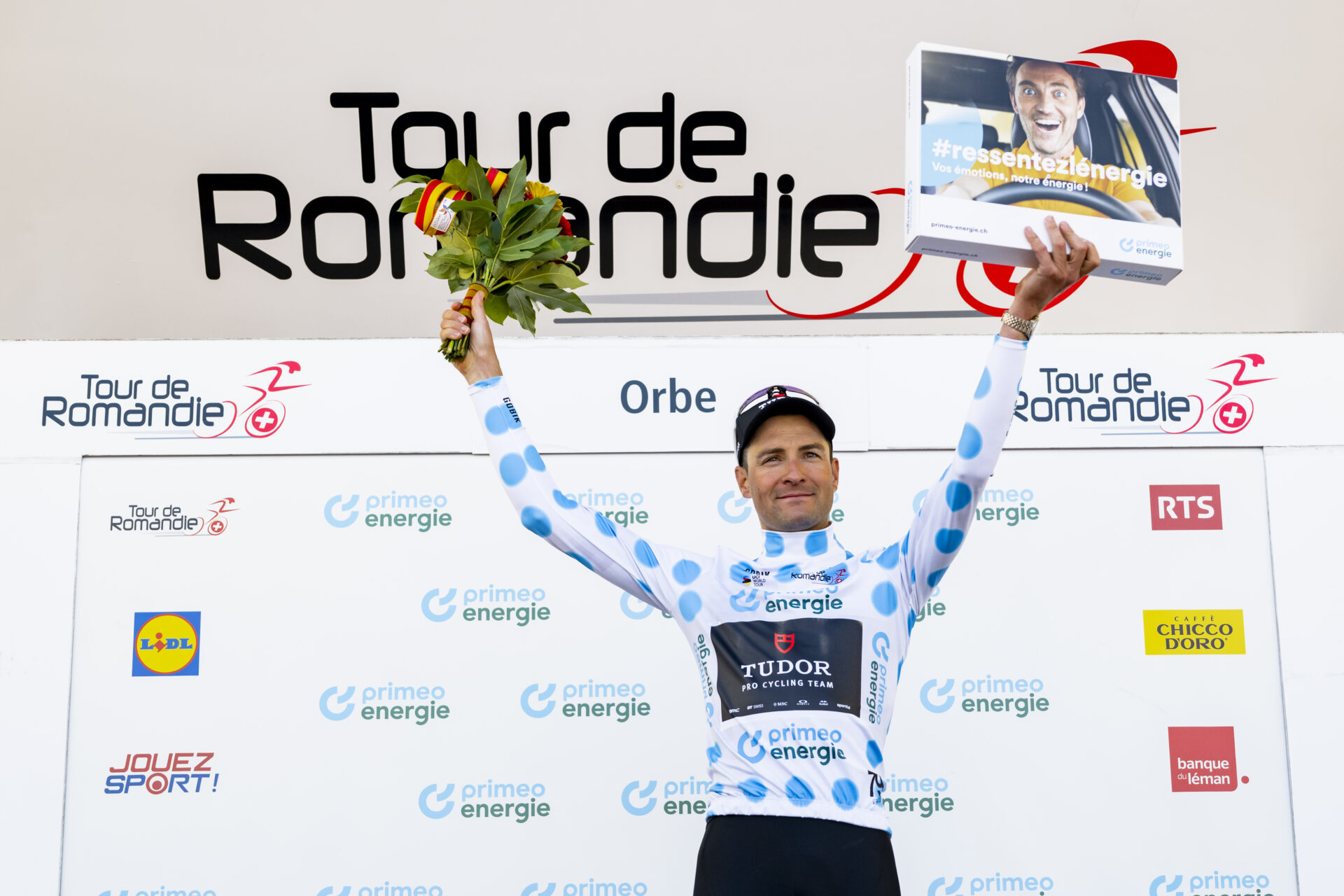 Roland Thalmann from Switzerland of Tudor Pro Cycling Team celebrates on the podium during the third stage, a 176,6 km race around Orbe at the 79th Tour de Romandie UCI World Tour Cycling race, in Orbe, Switzerland, Friday, May 1, 2026. (KEYSTONE/Jean-Christophe Bott)