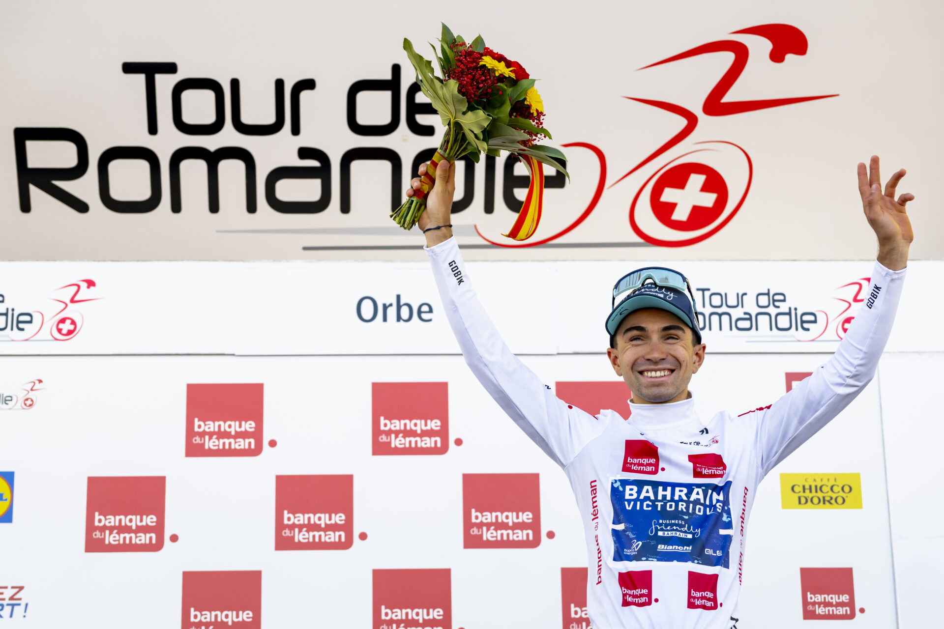 Lenny Martinez from France of team Bahrain Victorious celebrates on the podium during the third stage, a 176,6 km race around Orbe at the 79th Tour de Romandie UCI World Tour Cycling race, in Orbe, Switzerland, Friday, May 1, 2026. (KEYSTONE/Jean-Christophe Bott)