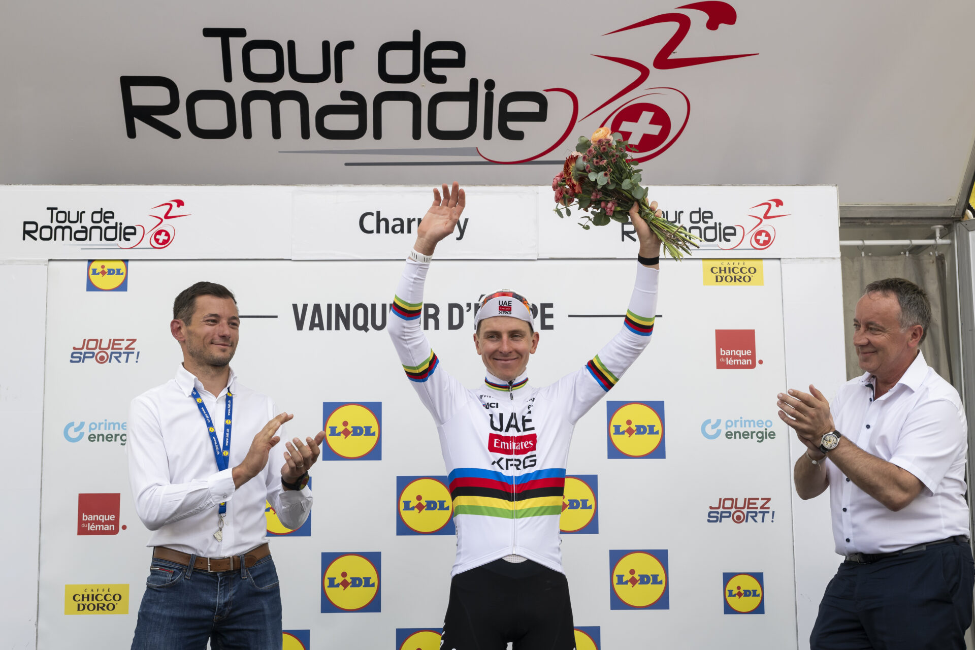 The winner of the stage Tadej Pogacar from Slovenia of UAE Team Emirates XRG celebrates on the podium during the fourth stage, a 149,6 km race between Broc and Charmey at the 79th Tour de Romandie UCI World Tour Cycling race, in Charmey, Switzerland, Saturday, May 2, 2026. (KEYSTONE/Jean-Christophe Bott)