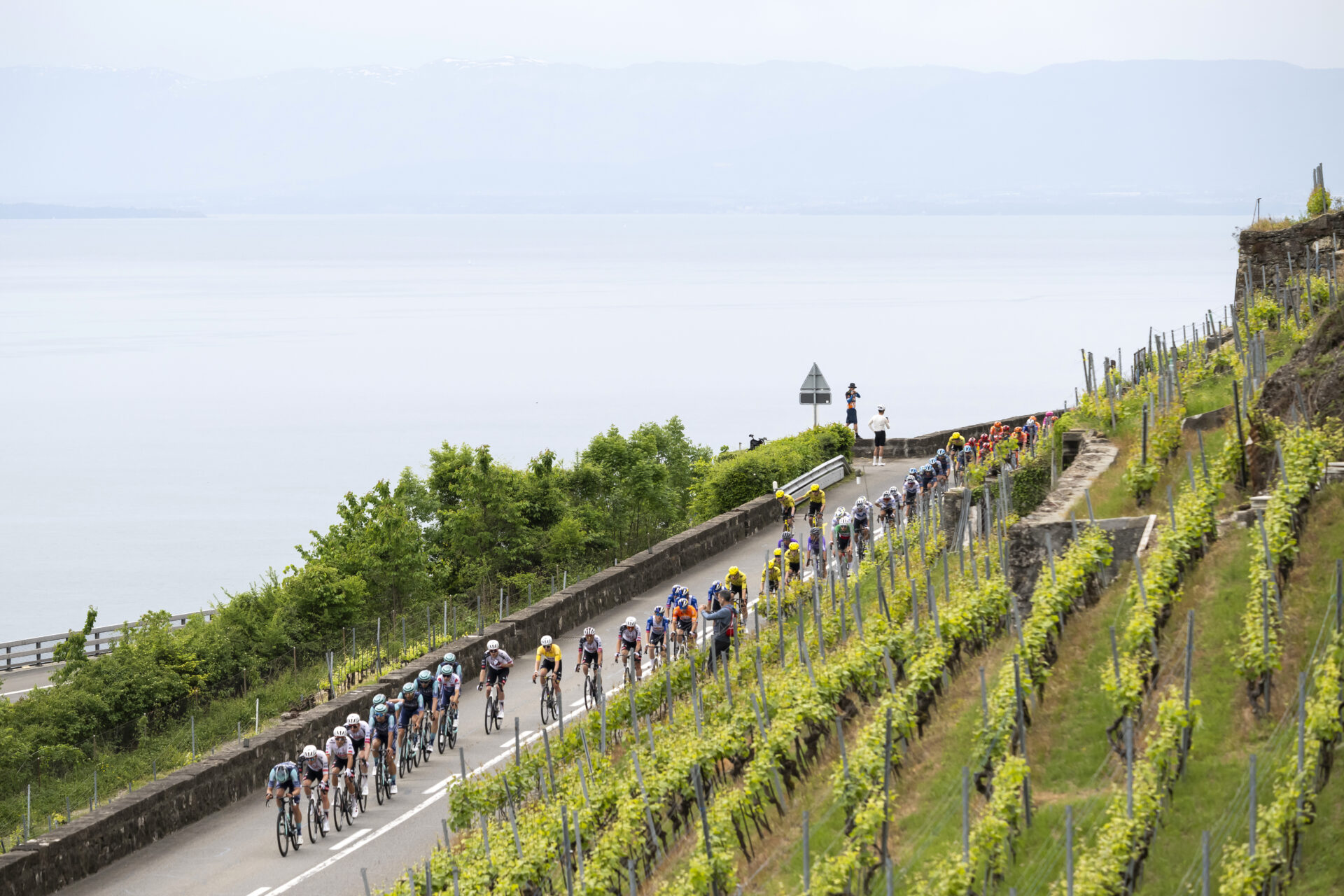 The overall leader Tadej Pogacar from Slovenia of UAE Team Emirates XRG, with the yellow jersey, inside the pack of riders in action during the fifth and last stage, a 178,2 km race between Lucens and Leysin at the 79th Tour de Romandie UCI World Tour Cycling race, in Chardonne, Switzerland, Sunday, May 3, 2026. (KEYSTONE/Jean-Christophe Bott)