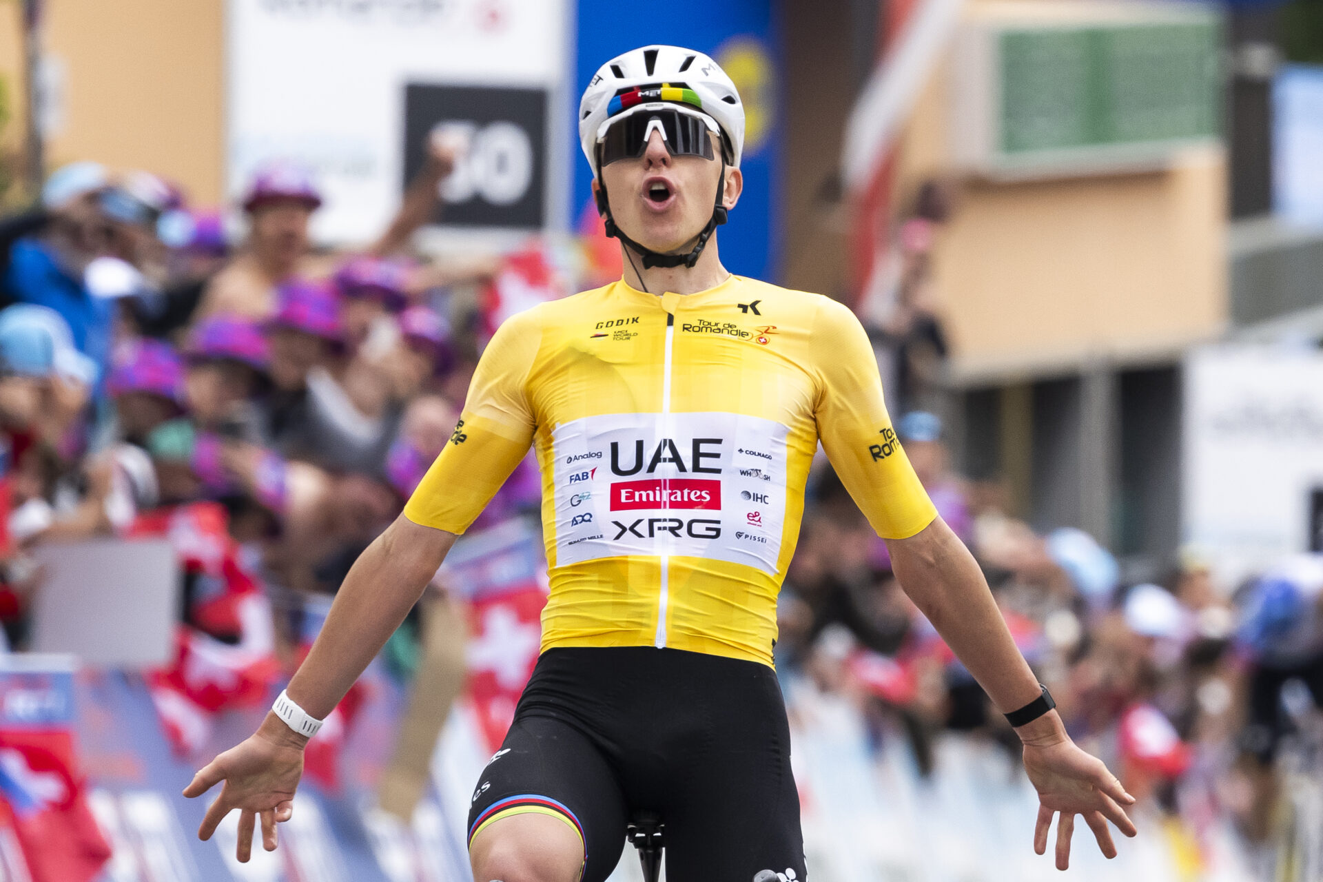 Tadej Pogacar from Slovenia of UAE Team Emirates XRG raises his arms after crossing the finish line to win during the fifth and last stage, a 178,2 km race between Lucens and Leysin at the 79th Tour de Romandie UCI World Tour Cycling race, in Leysin, Switzerland, Sunday, May 3, 2026. (KEYSTONE/Jean-Christophe Bott)