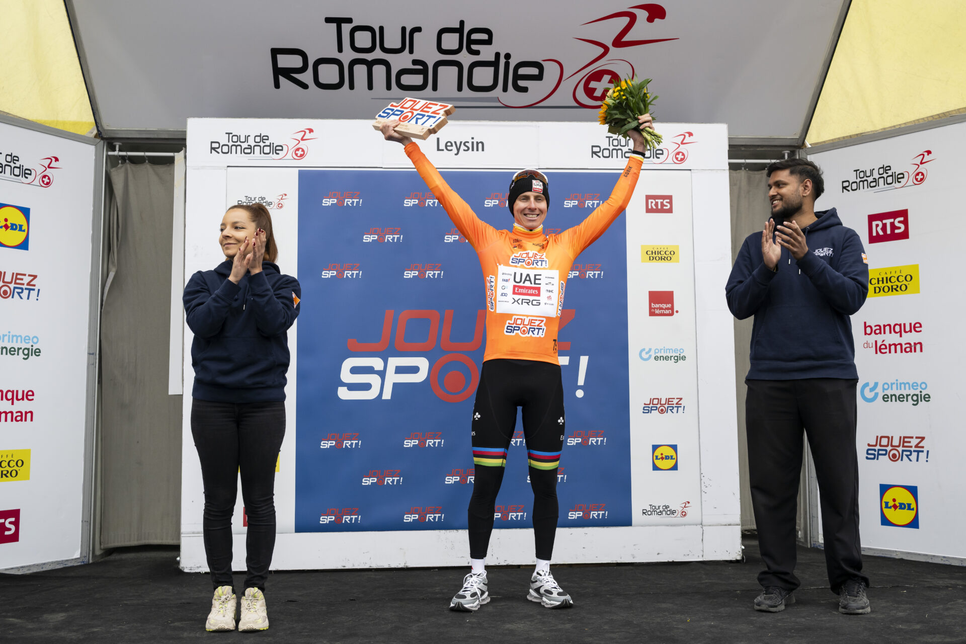 Tadej Pogacar from Slovenia of UAE Team Emirates XRG celebrates on the podium during the fifth and last stage, a 178,2 km race between Lucens and Leysin at the 79th Tour de Romandie UCI World Tour Cycling race, in Leysin, Switzerland, Sunday, May 3, 2026. (KEYSTONE/Jean-Christophe Bott)