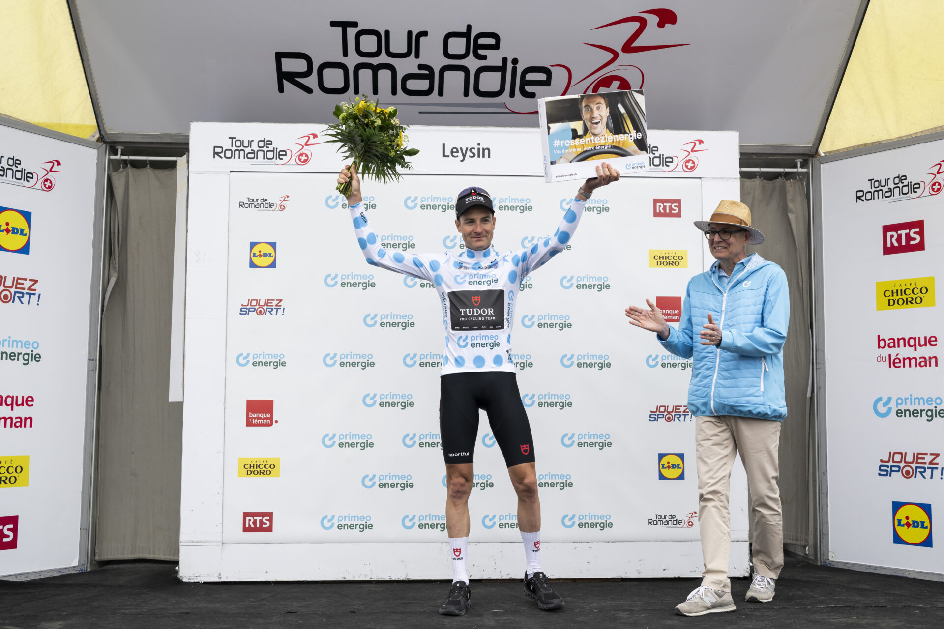 Roland Thalmann from Switzerland of Tudor Pro Cycling Team celebrates on the podium during the fifth and last stage, a 178,2 km race between Lucens and Leysin at the 79th Tour de Romandie UCI World Tour Cycling race, in Leysin, Switzerland, Sunday, May 3, 2026. (KEYSTONE/Jean-Christophe Bott)